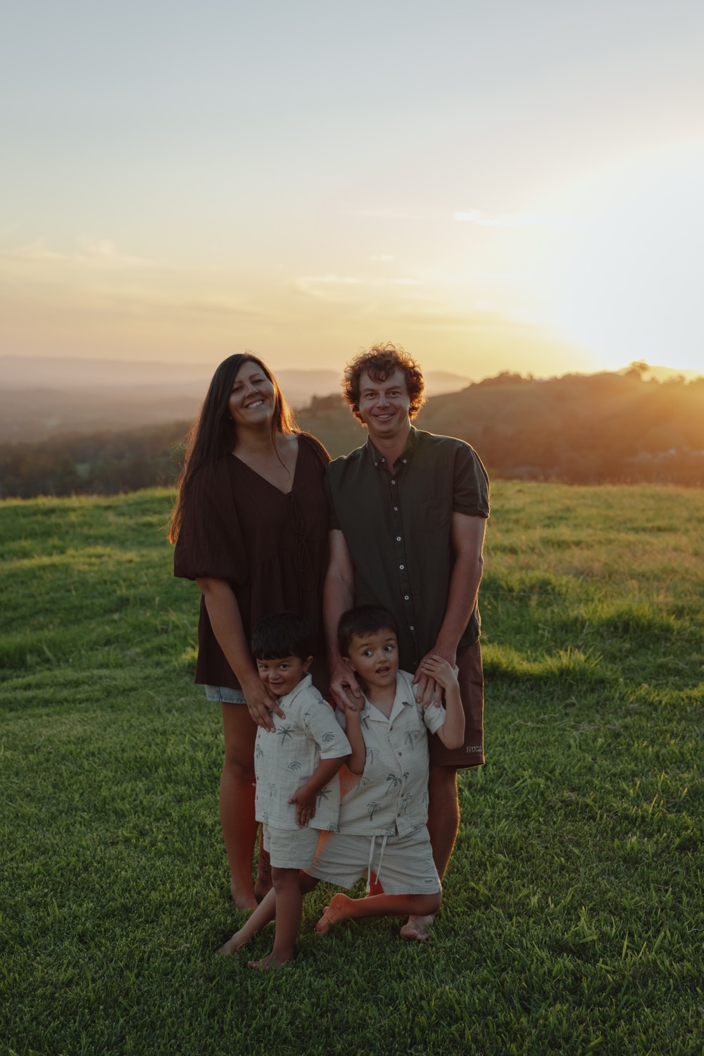 Tiaki, Elliot and their two boys, the local family behind CoasTrade Fencing, at sunset on the Sunshine Coast