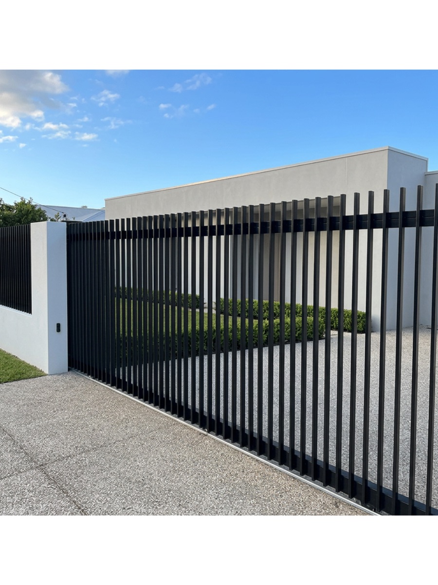 Black aluminium slat electric driveway gate by CoasTrade on the Sunshine Coast